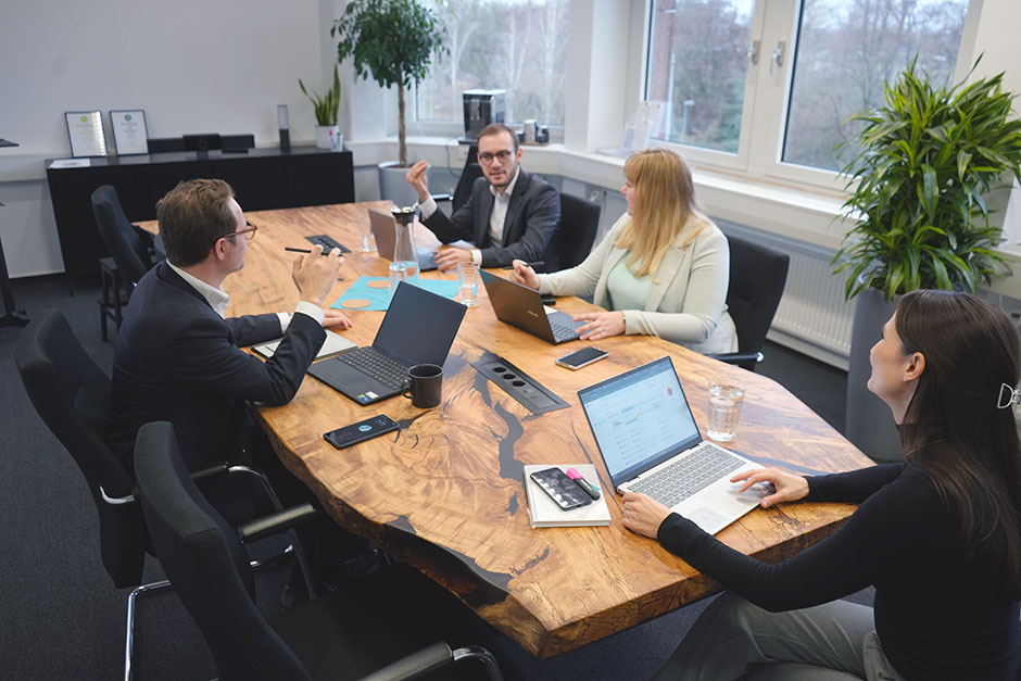 Four persons in a meeting
